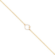 Bracelet doré Adina motif anneau orné de zircons et d'une petite étoile - Bijou photographié sur fond blanc