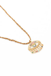 Collier doré Auri œil zircons multicolores - Bijou photographié sur fond blanc