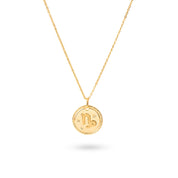 Collier doré signe astrologique Capricorne - Bijou photographié sur fond blanc