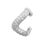 Bague d'oreille argent Dune en forme de vague sertie de zircons - Bijou photographié sur fond blanc