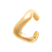 Bague d'oreille dorée Dune en forme de vague - Bijou photographié sur fond blanc