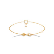 Bracelet doré Minnie fer à cheval serti de zircons avec pendentif - Bijou photographié sur fond blanc