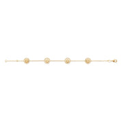 Bracelet “Soledad” en plaqué or avec pendentif en forme de soleil rayonnant, collection Chloé Rose Genève - Bijou photographié sur fond blanc