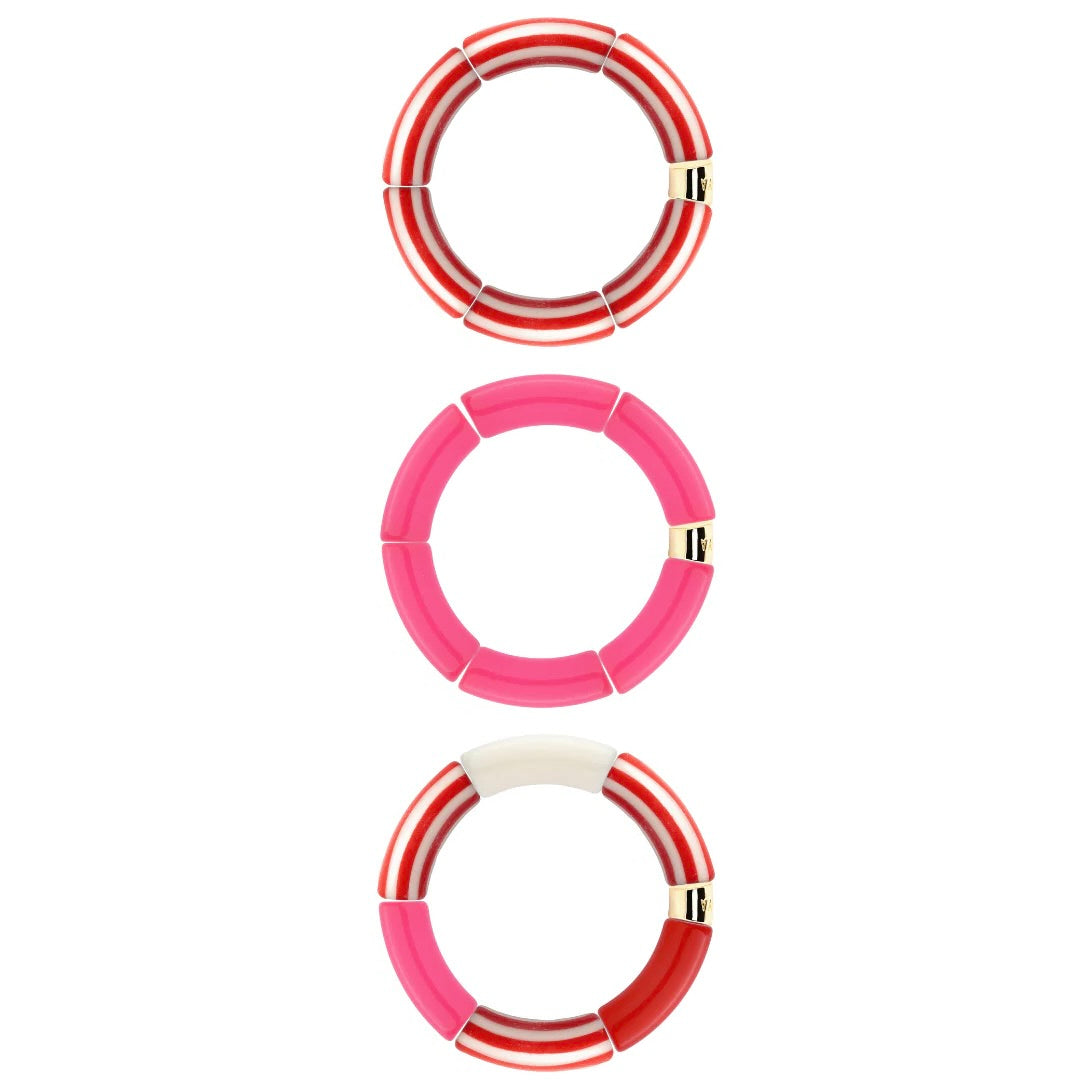 Bracelets dorés Riviera Magenta trio rouge, rose et blanc - Bijoux photographiés sur fond blanc