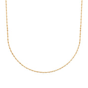 Collier doré Naya chaîne avec perles carrées - Bijou photographié sur fond blanc