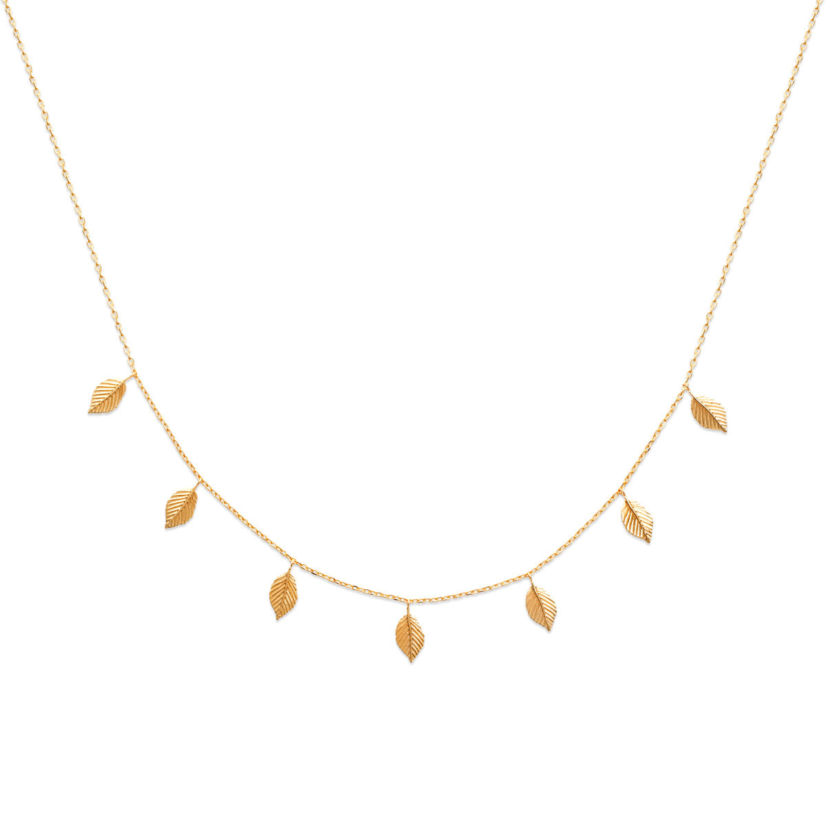 Collier doré Shona pampilles feuilles - bijou photographié sur fond blanc