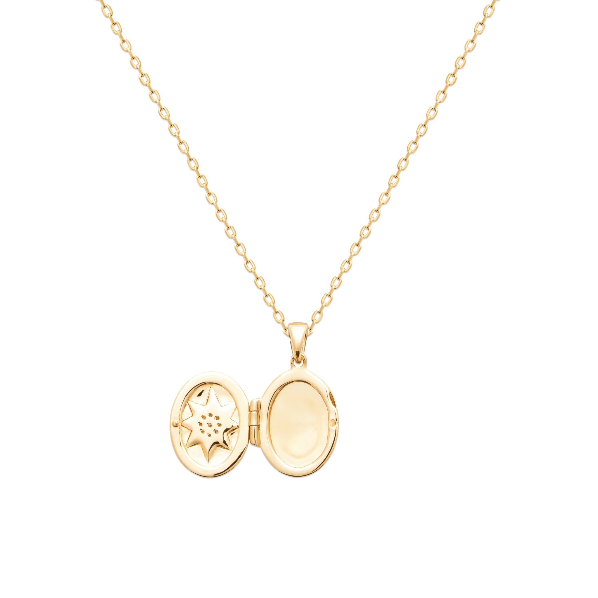 Médaillon ouvrant Elvira doré ovale avec étoile polaire sertie de zircons - Bijou photographié sur fond blanc